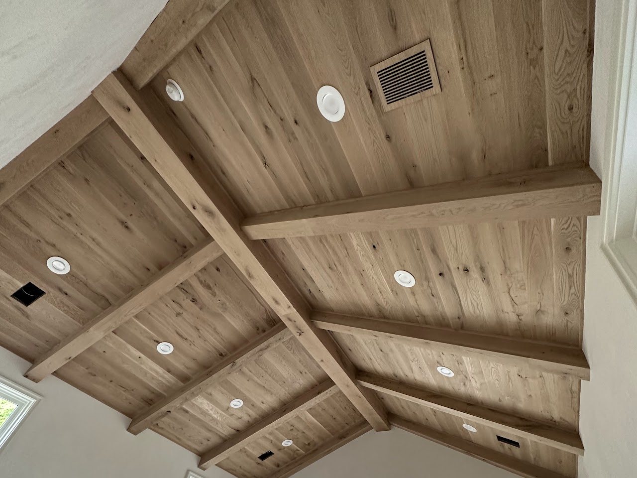 Vaulted oak plank ceiling with box beams, by SV Construction