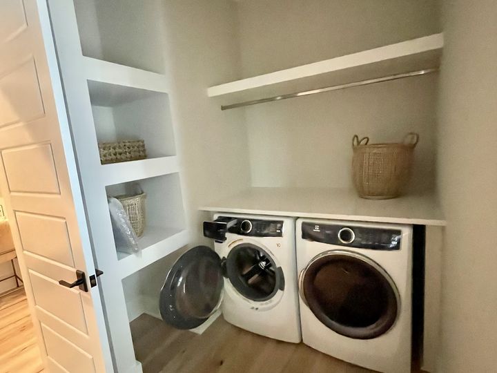 Laundry closet with built in shelves and counter, by SV Construction