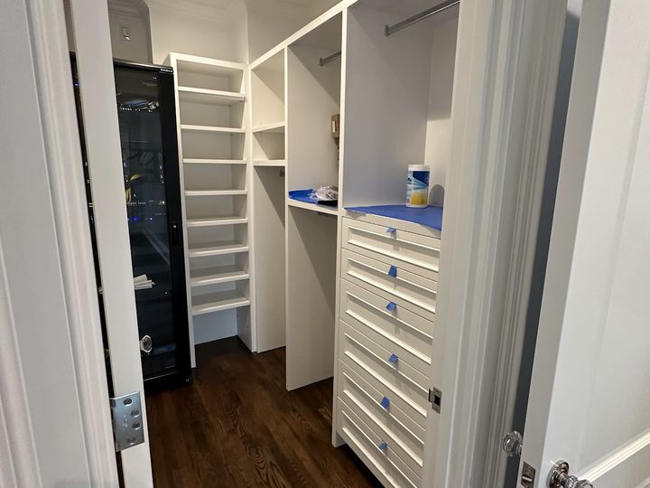 Walk in closet with drawers and shoe shelves, by SV Construction
