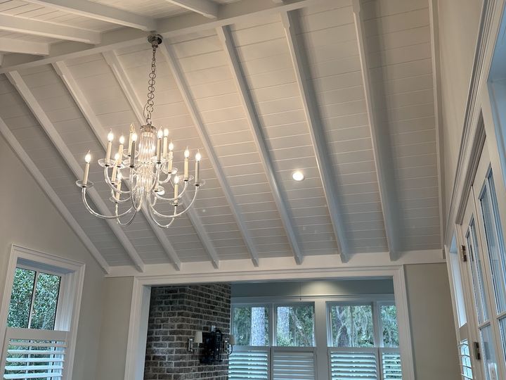 Painted shiplap ceiling with exposed beams, by SV Construction