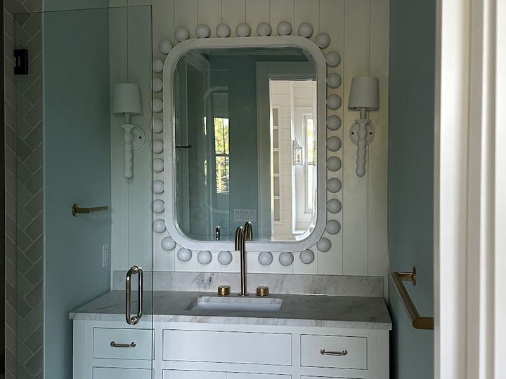 Bathroom vanity with marble top and glass shower, by SV Construction
