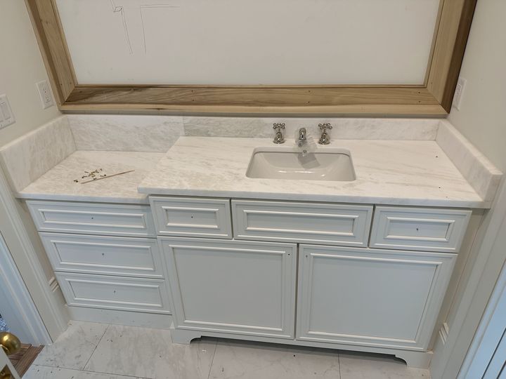 B bathroom vanity with marble top and inset drawers, by SV Construction