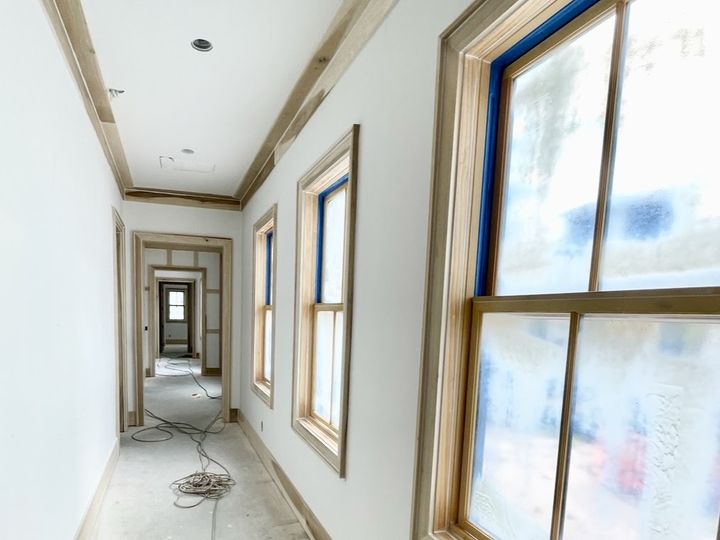 Hallway with window and door casings, by SV Construction